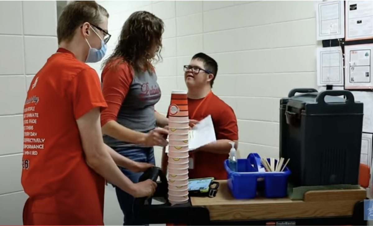 Teacher Valerie Newton manages the coffee cart. Students deliver coffee to teachers and practice social skills.